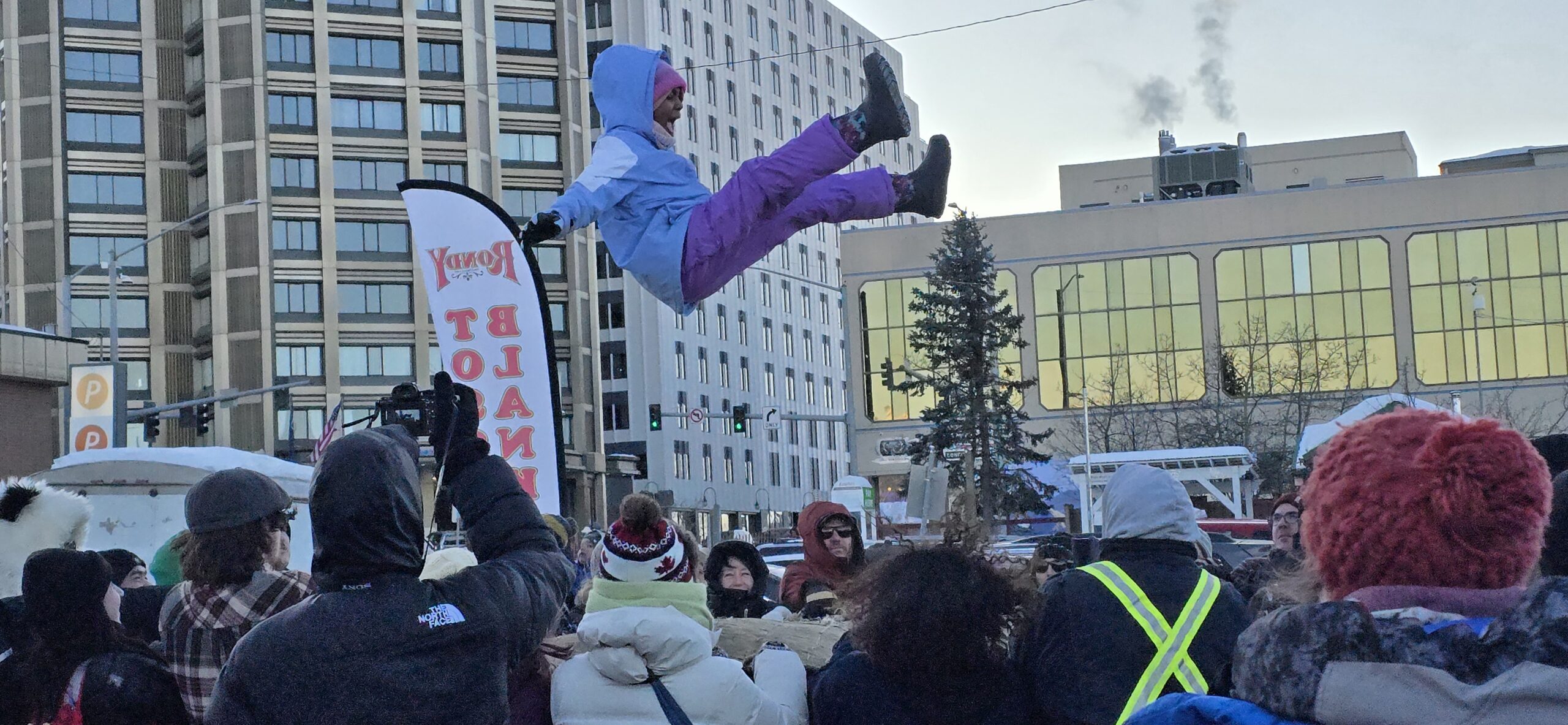 The blanket toss is Native Alaskan/Indigenous tradition. The blanket is made of thick animal skin, hand stitched to withhold the pulling and lifting motions during the process of tossing. The process of this beautiful tradition is done by about 12 people in a circle. I actually did the toss pulling before Mateu got tossed up in the air, because we all worked together, the pulling was not 